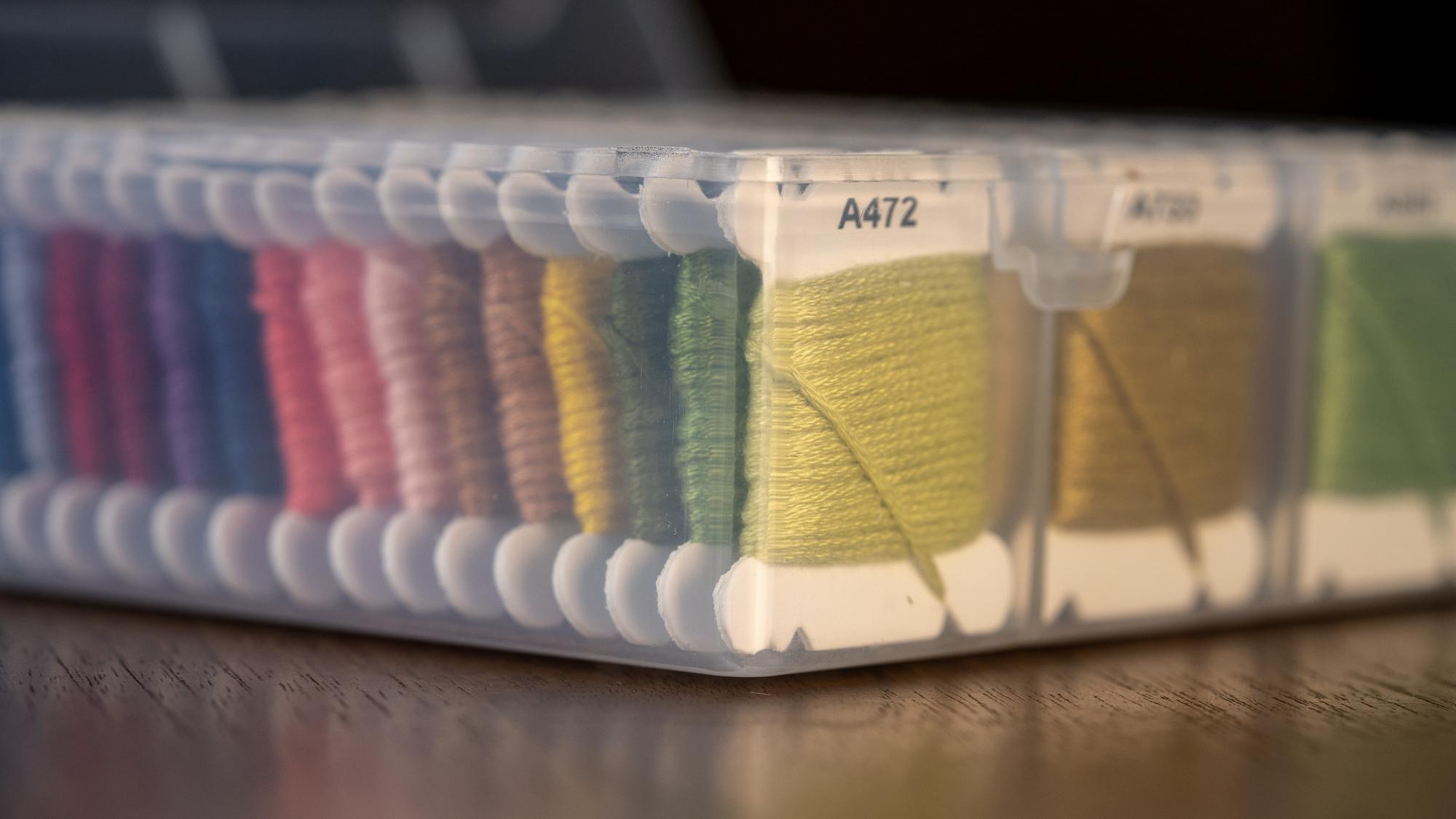 Stack of embroidered samples with color swatches